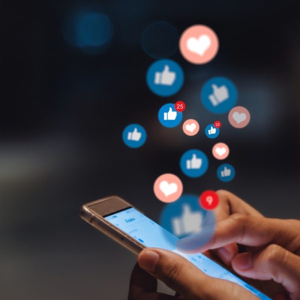 Young,Woman,Using,Smart,Phone,social,Media,Concept.,Vertical